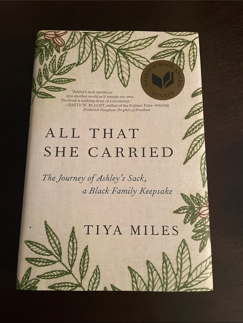 All That She Carried by Tiya Miles - Hardcover, Beige with Green Leaf Design